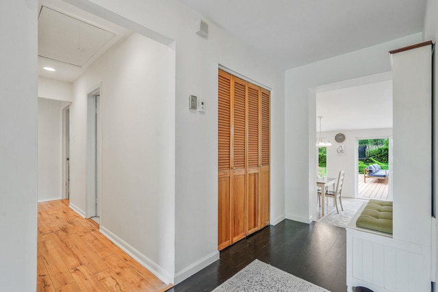 215 Lyman Rd, East Patchogue, NY 11772 - hall with attic access, wood finished floors, baseboards, and recessed lighting