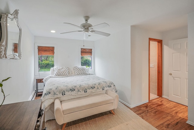 215 Lyman Rd, East Patchogue, NY 11772 - bedroom featuring wood finished floors, a baseboard heating unit, recessed lighting, baseboards, and ceiling fan
