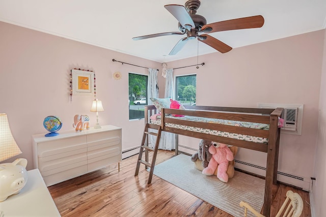 215 Lyman Rd, East Patchogue, NY 11772 - bedroom featuring wood finished floors and a ceiling fan