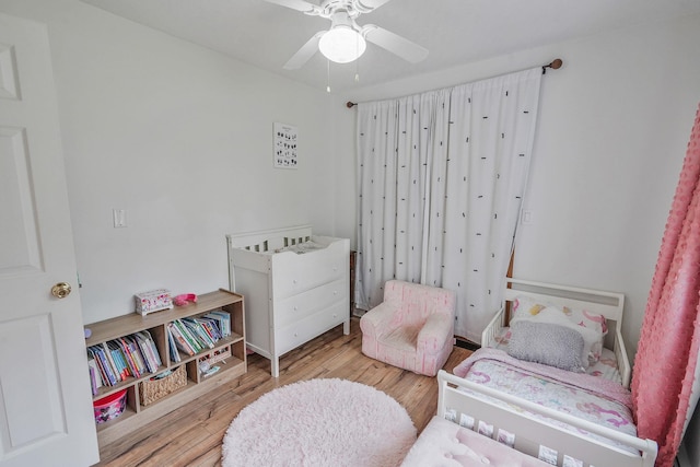 215 Lyman Rd, East Patchogue, NY 11772 - bedroom with wood finished floors and a ceiling fan