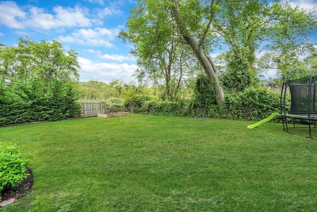 215 Lyman Rd, East Patchogue, NY 11772 - view of yard with a trampoline