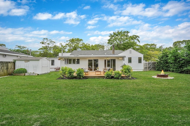 215 Lyman Rd, East Patchogue, NY 11772 - rear view of property featuring a deck and a fire pit