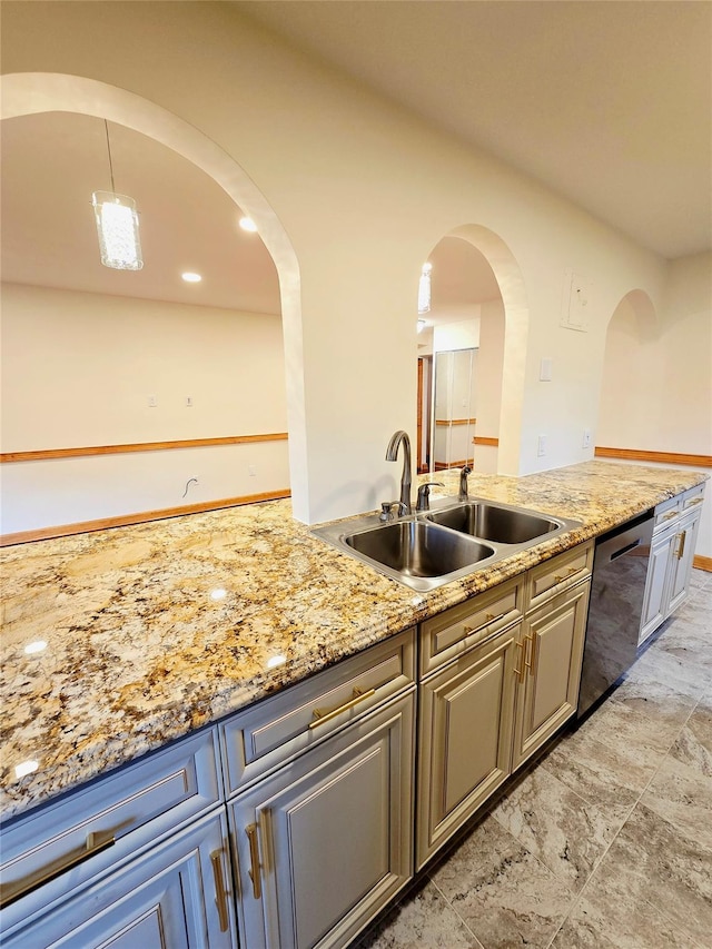 505 Central Ave Unit 211, White Plains, NY 10606 - kitchen with stainless steel dishwasher, a sink, arched walkways, and light stone counters