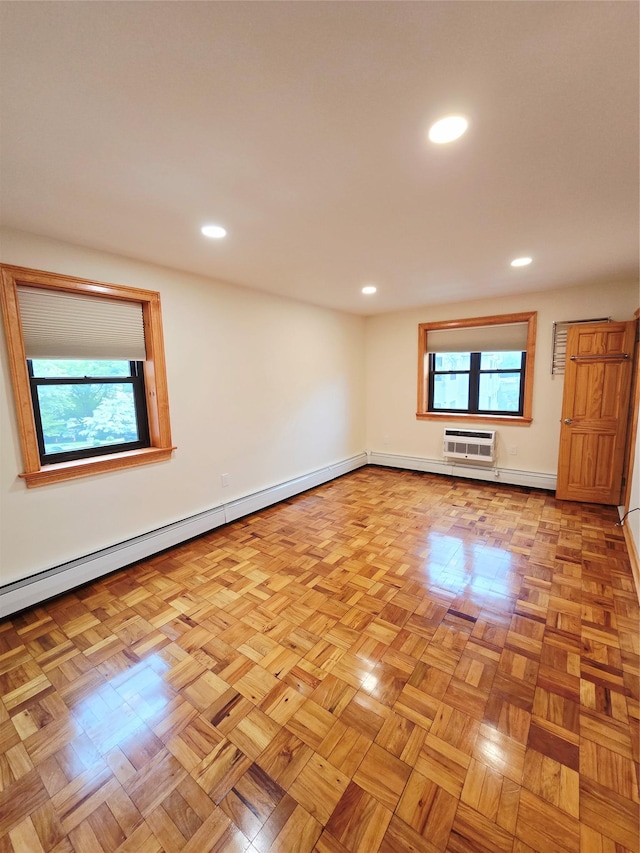 505 Central Ave Unit 211, White Plains, NY 10606 - empty room featuring a baseboard heating unit, recessed lighting, a wall mounted air conditioner, and baseboards
