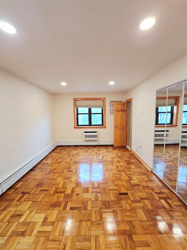 505 Central Ave Unit 211, White Plains, NY 10606 - spare room with a wall mounted AC, a baseboard heating unit, baseboards, and recessed lighting
