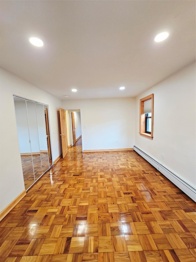 505 Central Ave Unit 211, White Plains, NY 10606 - below grade area with baseboards, recessed lighting, and baseboard heating