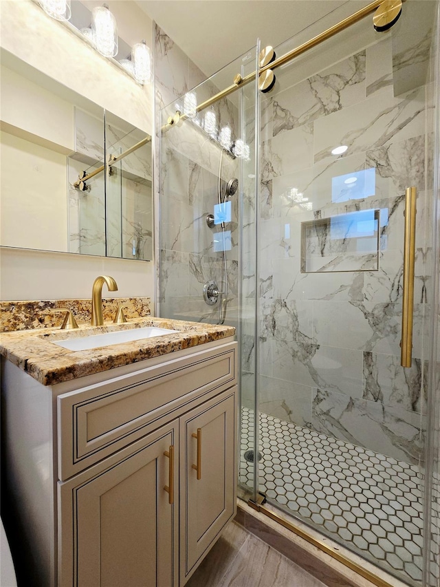 505 Central Ave Unit 211, White Plains, NY 10606 - bathroom with a marble finish shower, vanity, and wood finished floors
