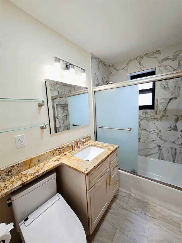 505 Central Ave Unit 211, White Plains, NY 10606 - full bathroom featuring vanity, marble finish floors, combined bath / shower with glass door, and toilet
