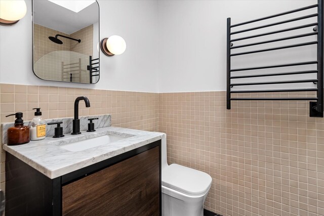 209 Onderdonk Ave, Ridgewood, NY 11385 - bathroom featuring radiator, tile walls, a tile shower, a towel warmer, and toilet