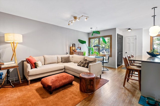 209 Onderdonk Ave, Ridgewood, NY 11385 - living area with healthy amount of natural light, wood finished floors, and baseboards