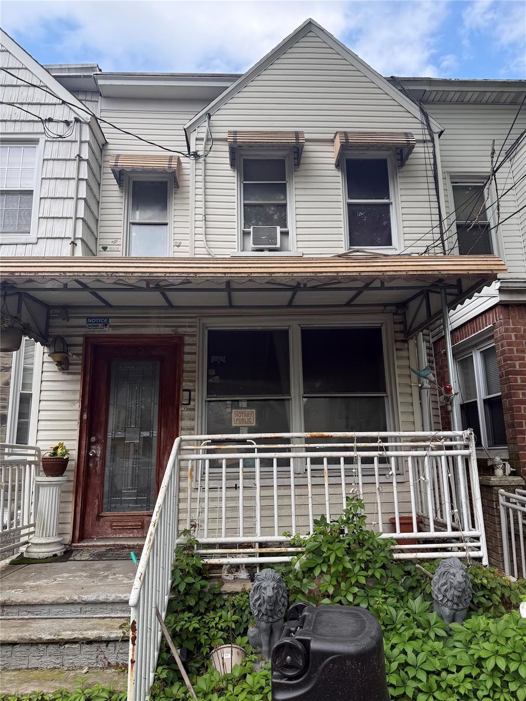 9423 115th St, Richmond Hill, NY 11419 - view of property with a porch and cooling unit