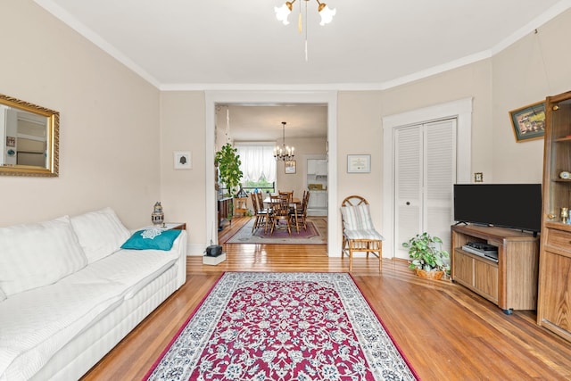 33-21 82nd St Unit 51, Jackson Heights, NY 11372 - living room featuring a chandelier, light wood-style flooring, and ornamental molding