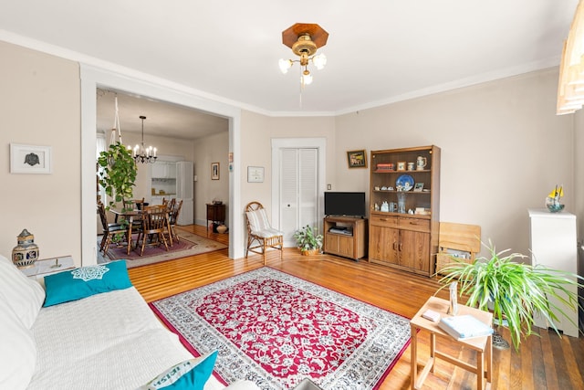 33-21 82nd St Unit 51, Jackson Heights, NY 11372 - living area featuring wood finished floors, a chandelier, and ornamental molding