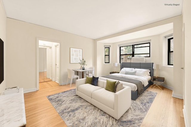 34-21 78th St Unit 1H, Jackson Heights, NY 11372 - bedroom featuring light wood-type flooring and baseboards