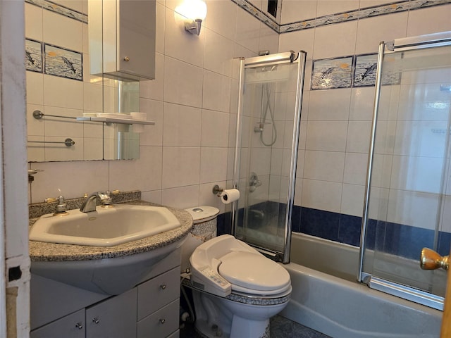 152-18 Union Tpke Unit 11J, Kew Garden Hills, NY 11367 - full bathroom with vanity, tile walls, toilet, and shower / bath combination with glass door