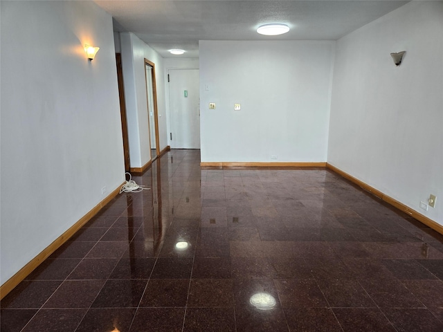 152-18 Union Tpke Unit 11J, Kew Garden Hills, NY 11367 - empty room with baseboards and granite tiled floors