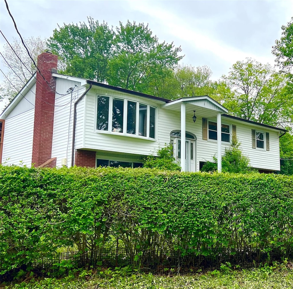 6 Pelham Dr, Carmel, NY 10512 - raised ranch with a chimney