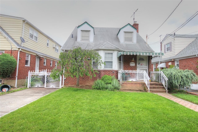 115-31 237th St, Elmont, NY 11003 - cape cod home with a porch, brick siding, and a chimney