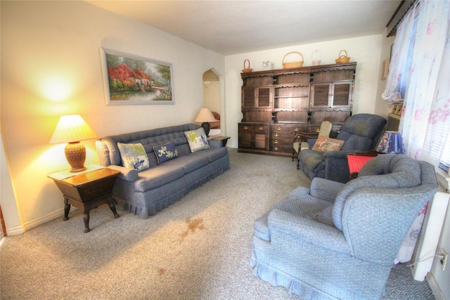 115-31 237th St, Elmont, NY 11003 - carpeted living area featuring arched walkways and baseboards