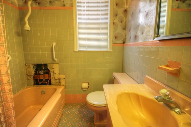 115-31 237th St, Elmont, NY 11003 - bathroom with tile walls, tile patterned flooring, toilet, and vanity