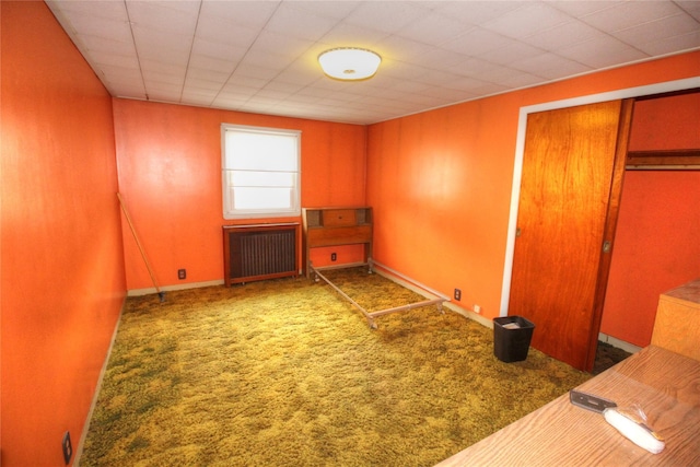 115-31 237th St, Elmont, NY 11003 - unfurnished bedroom with radiator, a closet, carpet floors, and baseboards
