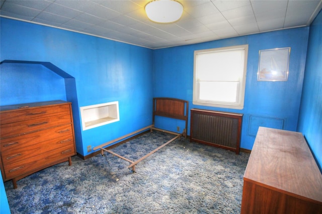 115-31 237th St, Elmont, NY 11003 - unfurnished bedroom with radiator heating unit, carpet, and baseboards