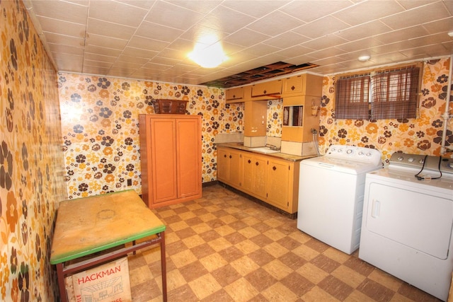 115-31 237th St, Elmont, NY 11003 - washroom featuring wallpapered walls, light flooring, separate washer and dryer, and cabinet space