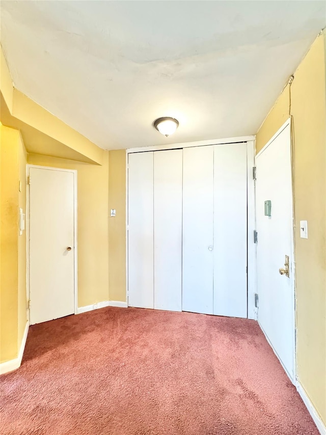 86-16 60th Ave Unit 5K, Elmhurst, NY 11373 - unfurnished bedroom featuring carpet, a closet, and baseboards
