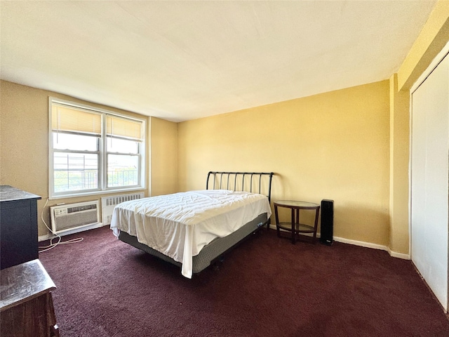 86-16 60th Ave Unit 5K, Elmhurst, NY 11373 - bedroom featuring an AC wall unit, dark colored carpet, radiator, and baseboards