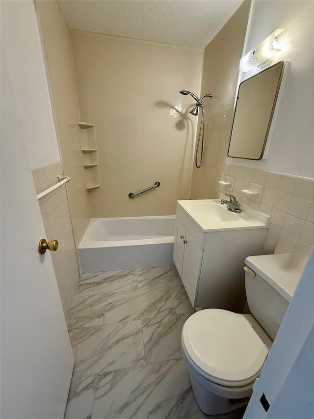 1966 Newbold Ave Unit 405, Bronx, NY 10472 - bathroom with marble look tiles, vanity, washtub / shower combination, and a textured ceiling