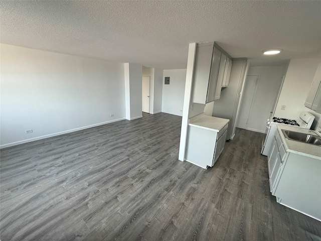 1966 Newbold Ave Unit 405, Bronx, NY 10472 - kitchen with gray cabinetry, light countertops, dark wood-style floors, a textured ceiling, and open floor plan