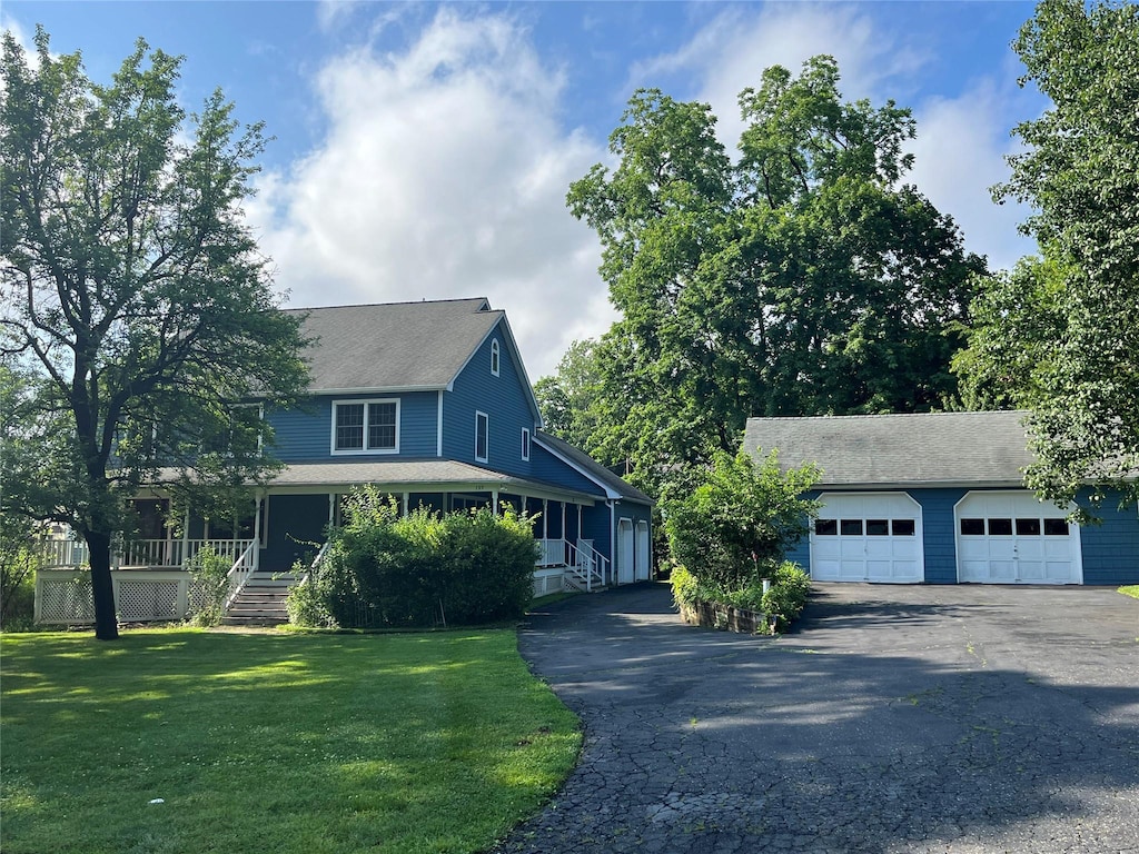 159 Martin Pl, Pearl River, NY 10965 - view of front of property featuring a garage, asphalt driveway, a front lawn, roof with shingles, and an outdoor structure