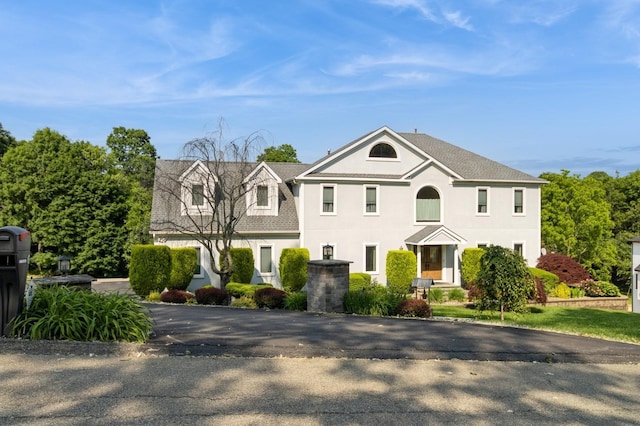 61 Sherwood Hts, Wappingers Falls, NY 12590 - view of front facade featuring stucco siding and roof with shingles