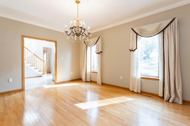 61 Sherwood Hts, Wappingers Falls, NY 12590 - empty room with a chandelier, light wood finished floors, stairway, ornamental molding, and baseboards