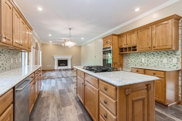 61 Sherwood Hts, Wappingers Falls, NY 12590 - kitchen featuring appliances with stainless steel finishes, dark wood-type flooring, a center island, tasteful backsplash, and light stone counters