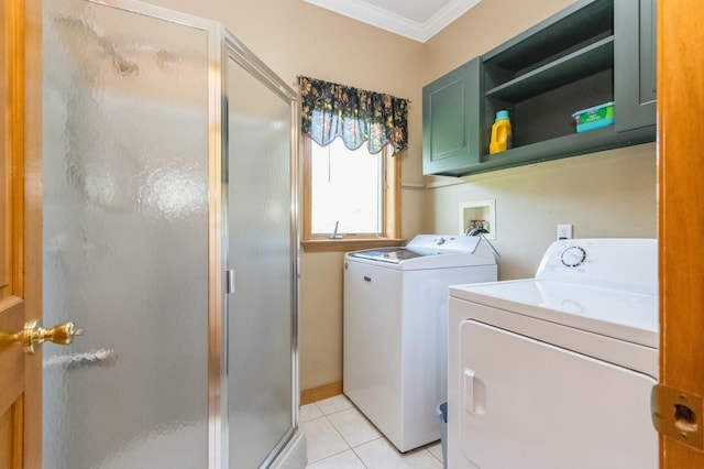 61 Sherwood Hts, Wappingers Falls, NY 12590 - washroom featuring washer and clothes dryer, ornamental molding, cabinet space, and light tile patterned floors