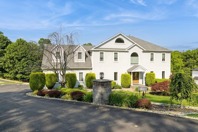 61 Sherwood Hts, Wappingers Falls, NY 12590 - view of front facade featuring roof with shingles and stucco siding