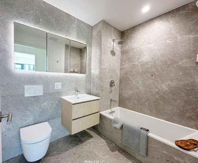 3005 Vernon Blvd Unit 4H, Astoria, NY 11102 - bathroom with tile walls, vanity, tiled shower / bath combo, toilet, and marble finish flooring