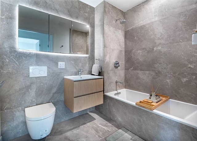 3005 Vernon Blvd Unit 4H, Astoria, NY 11102 - bathroom with tile walls, vanity, toilet, and a combined bath / shower with marble appearance