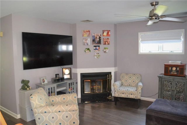 19 Maple Crest Dr, Peekskill, NY 10566 - living area with wood finished floors, a ceiling fan, a glass covered fireplace, and baseboards