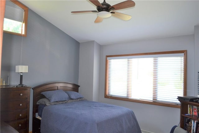 19 Maple Crest Dr, Peekskill, NY 10566 - bedroom with multiple windows, vaulted ceiling, and a ceiling fan