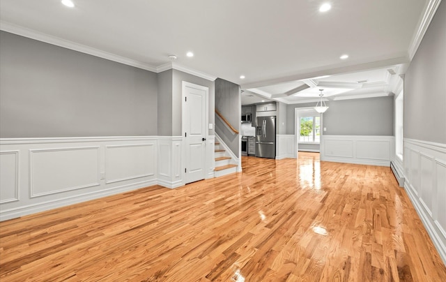 1850 Voshage St, Baldwin, NY 11510 - unfurnished living room with a baseboard radiator, ornamental molding, a decorative wall, recessed lighting, and light wood-style flooring