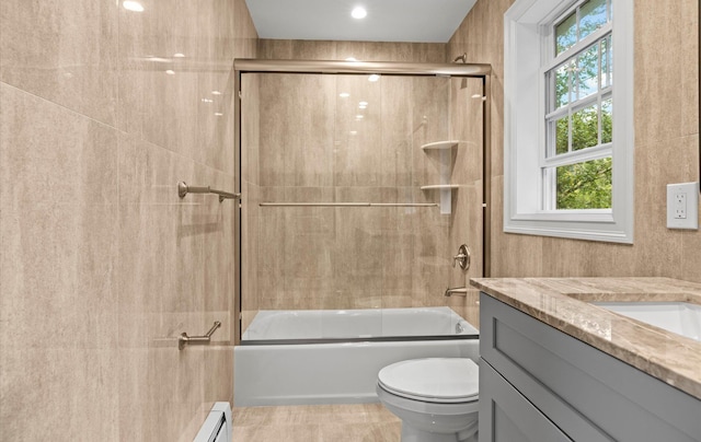 1850 Voshage St, Baldwin, NY 11510 - bathroom featuring vanity, toilet, shower / bath combination with glass door, and tile patterned flooring