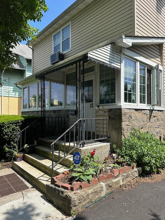 12 Ferdinand Pl, New Rochelle, NY 10801 - view of front of property featuring stone siding and cooling unit