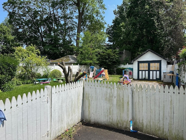 12 Ferdinand Pl, New Rochelle, NY 10801 - fenced yard featuring a playground