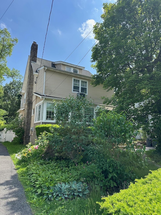 12 Ferdinand Pl, New Rochelle, NY 10801 - view of home's exterior featuring a chimney
