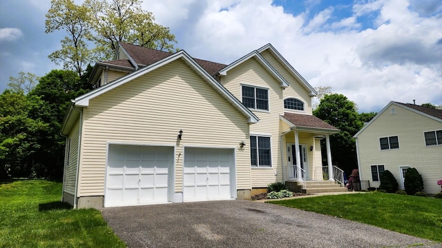 28 Hynard Pl, Baldwin Place, NY 10505 - traditional-style house featuring asphalt driveway, a front lawn, and a garage