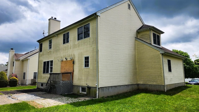 28 Hynard Pl, Baldwin Place, NY 10505 - rear view of house with a chimney