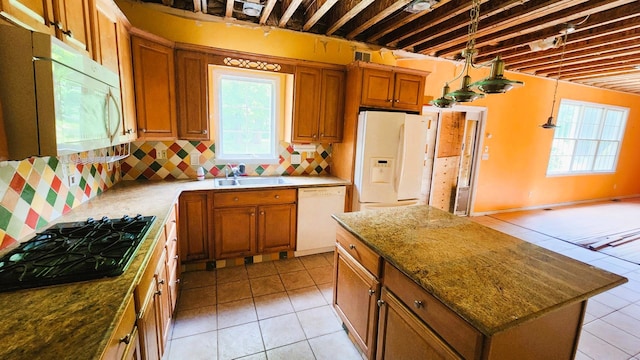 28 Hynard Pl, Baldwin Place, NY 10505 - kitchen featuring white appliances, light tile patterned flooring, a sink, and brown cabinetry