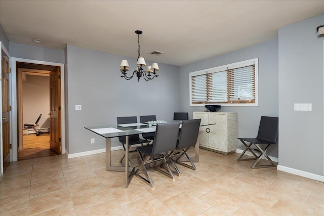 1360 Powell Ave, Merrick, NY 11566 - dining space featuring a chandelier, light tile patterned floors, and a baseboard radiator